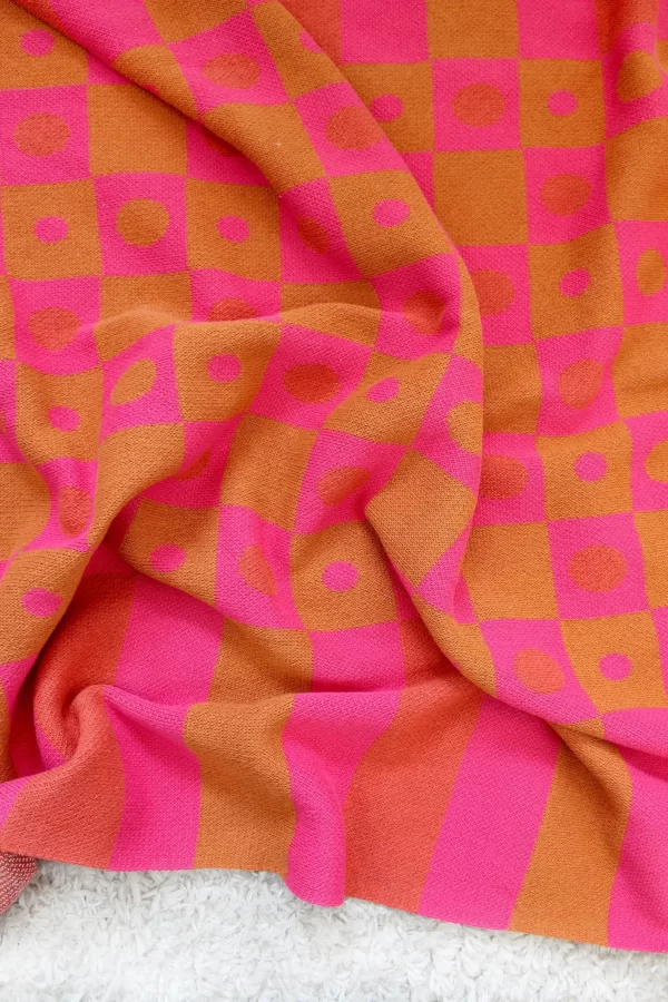 tan and pink check throw blankets by calhoun and co