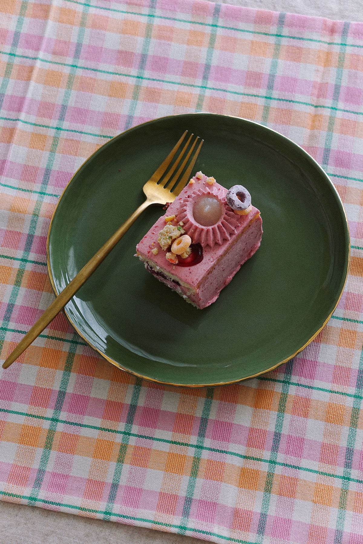 handmade green porcelain plate on archive plaid napkin