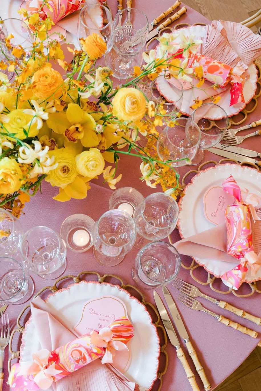 pink tablescape with poppy plates