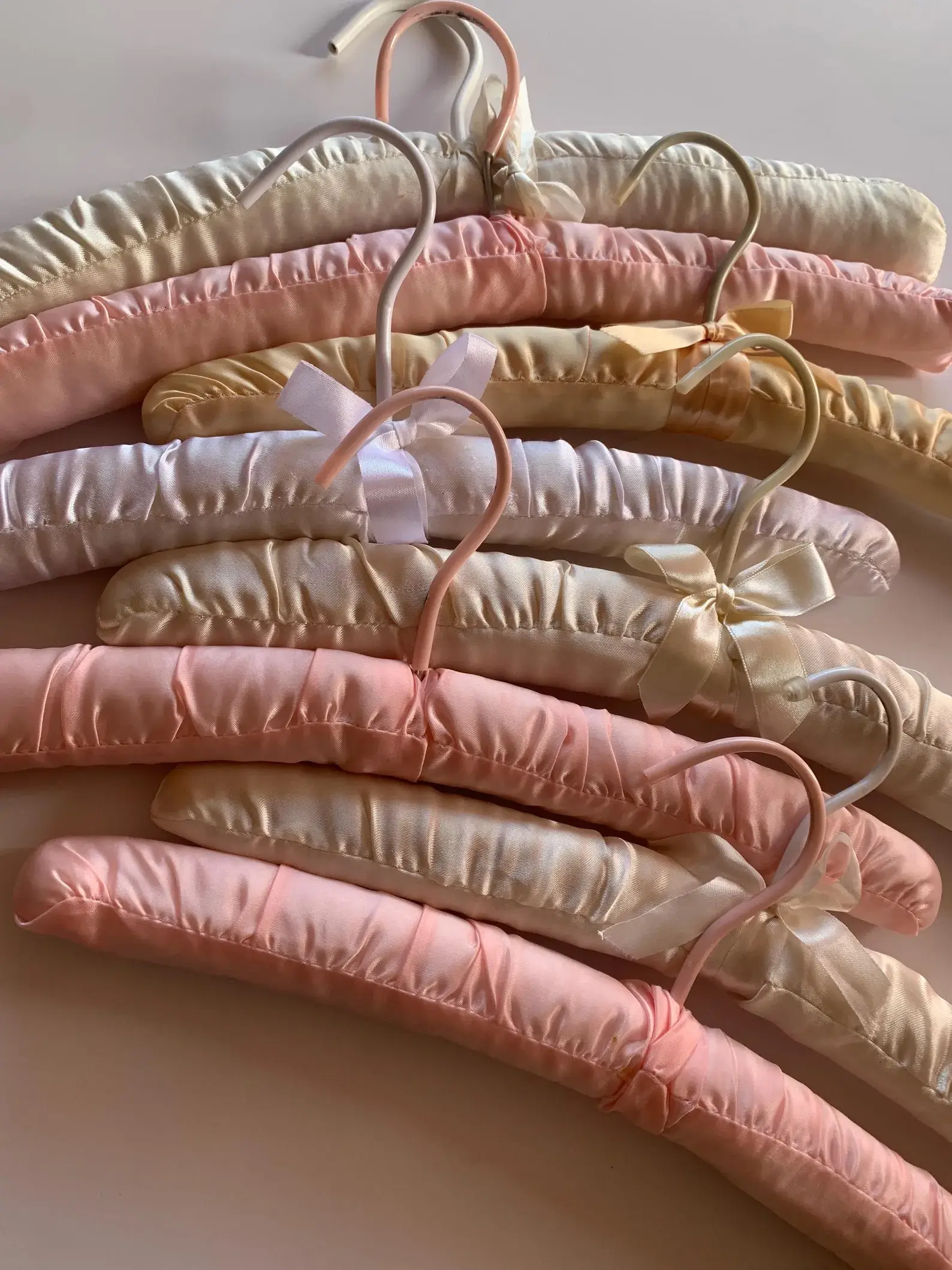 pastel pink padded vintage hangers with bows
