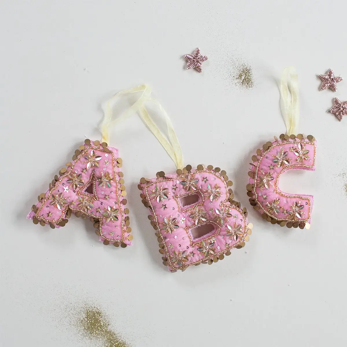 monogram ornaments in pink velvet