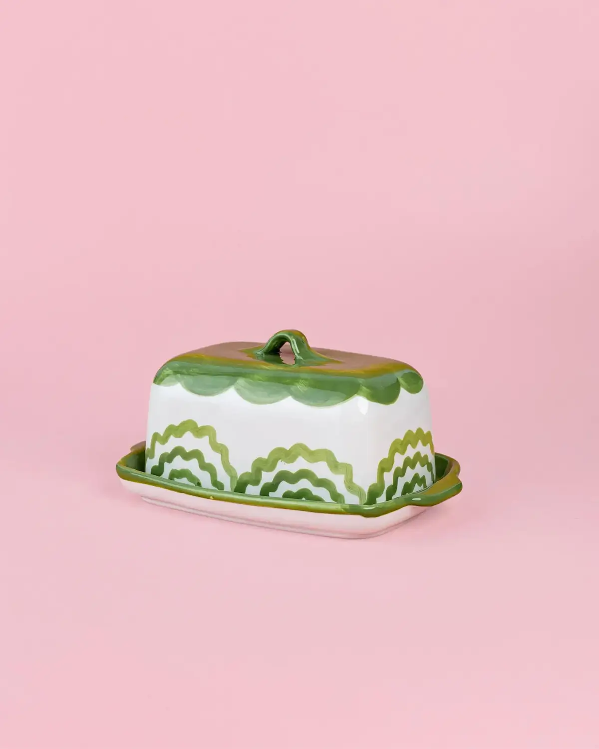 green and white scalloped ceramic butter dish