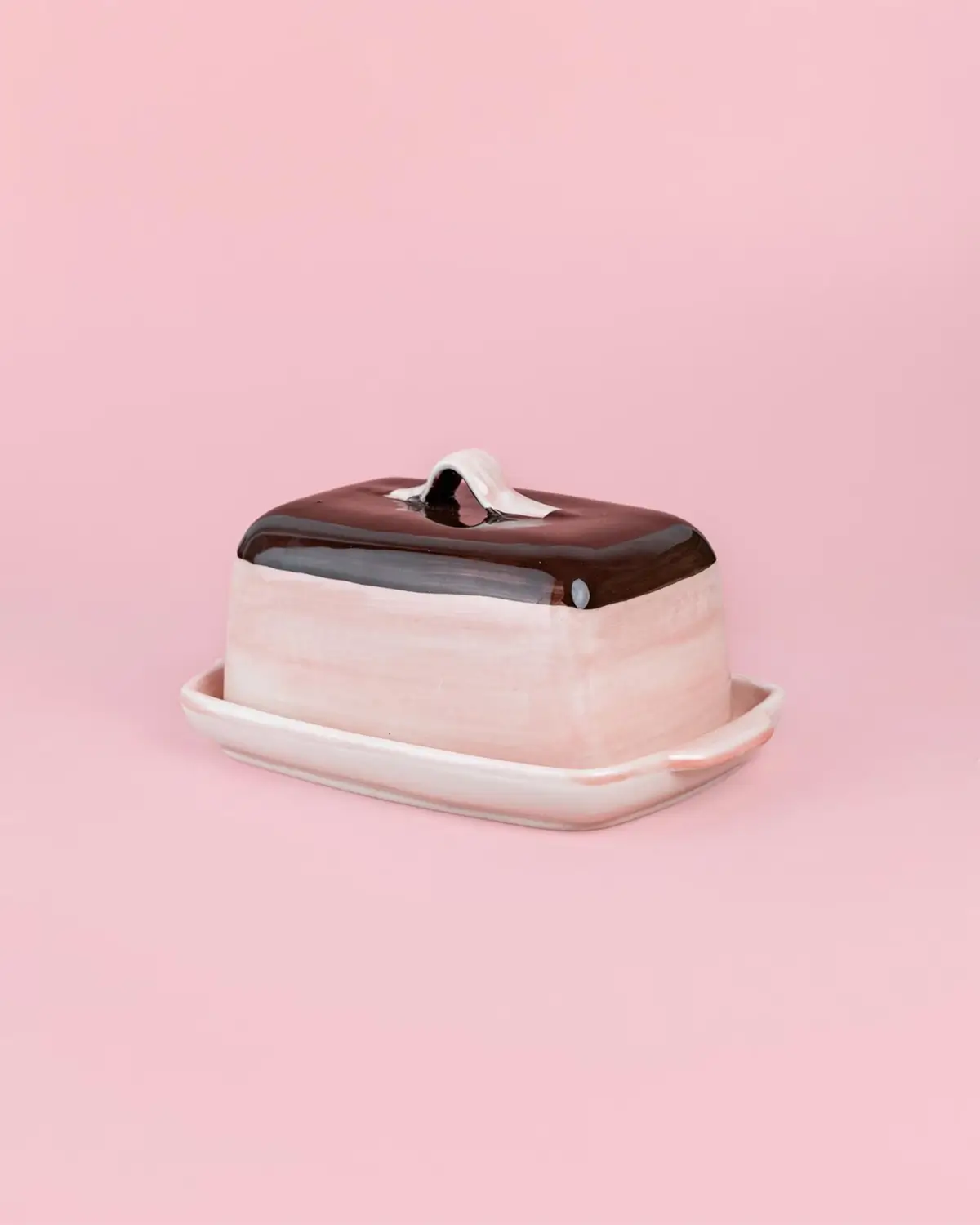 pink and brown ceramic butter dish