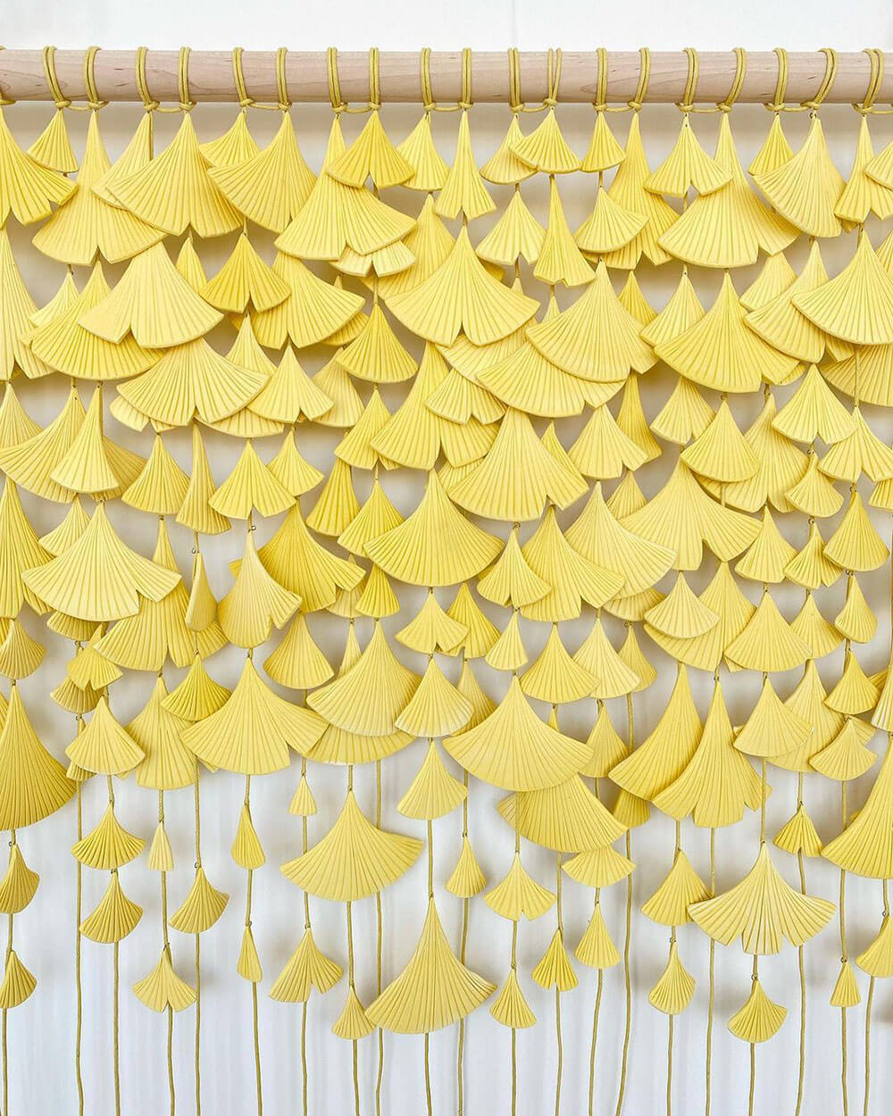 Yellow ceramic gingko leaf wall hanging by Anastasia Tumanova