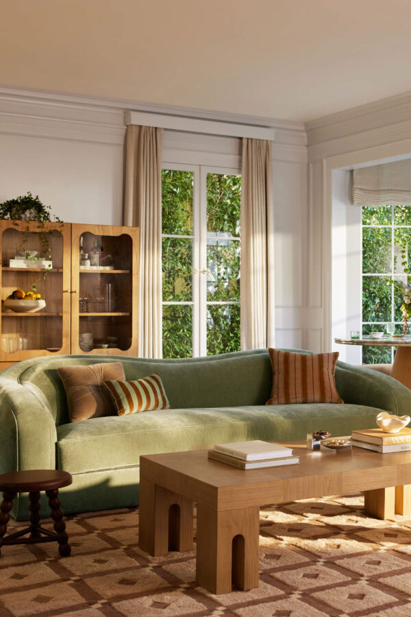 Lulu & Georgia curved sofa in green velvet