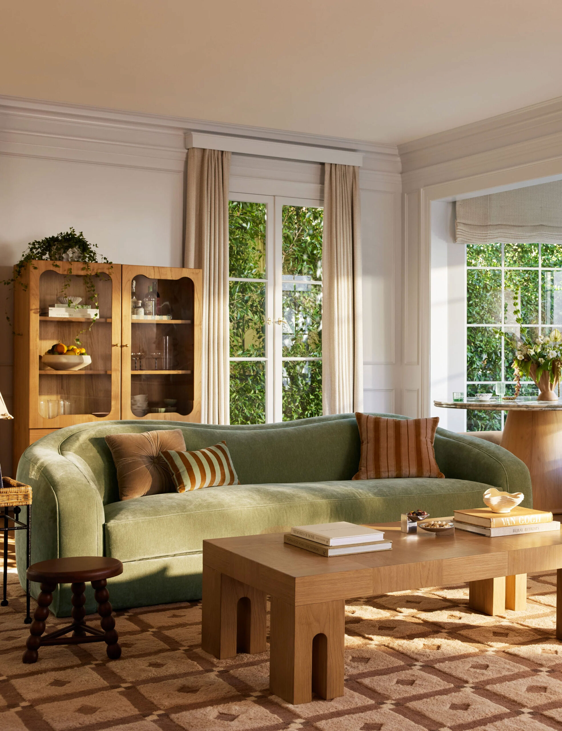 Lulu & Georgia curved sofa in green velvet