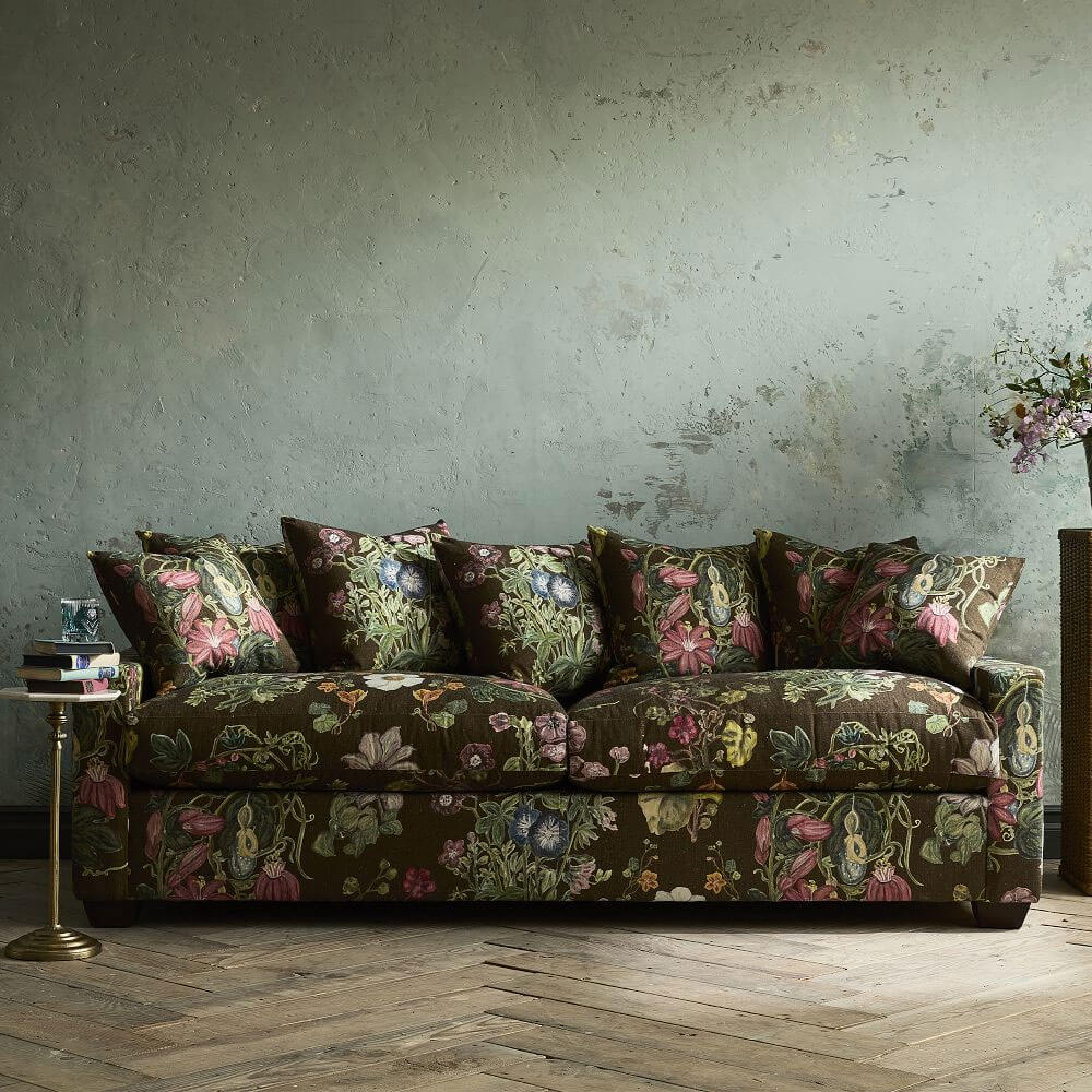 Dark moody floral upholstered sofa from Green Row