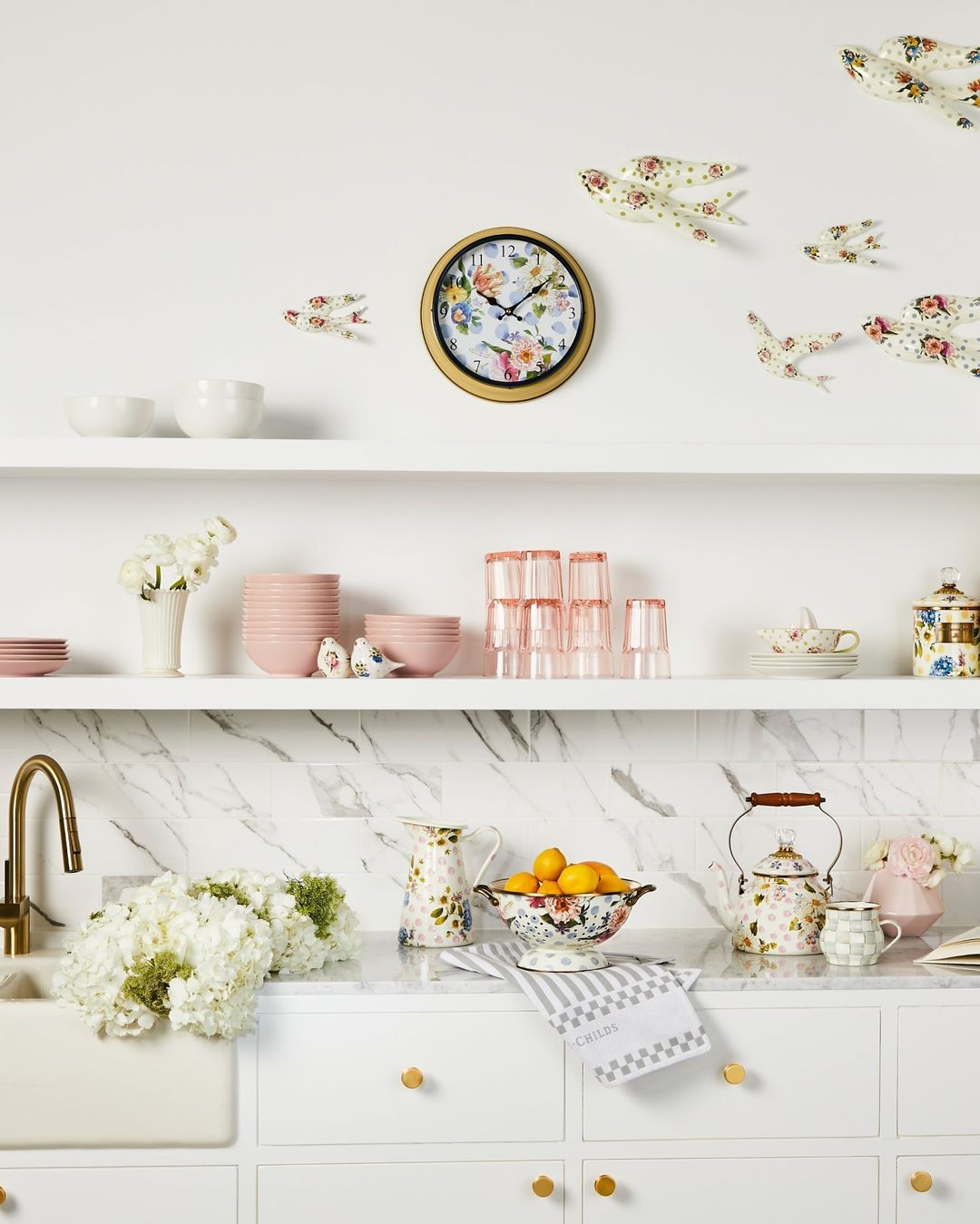 unique salt and pepper shakers on floral kitchen wall