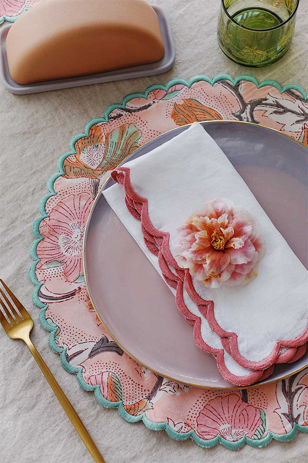 spring maximalist tablescape with pink scalloped placemats