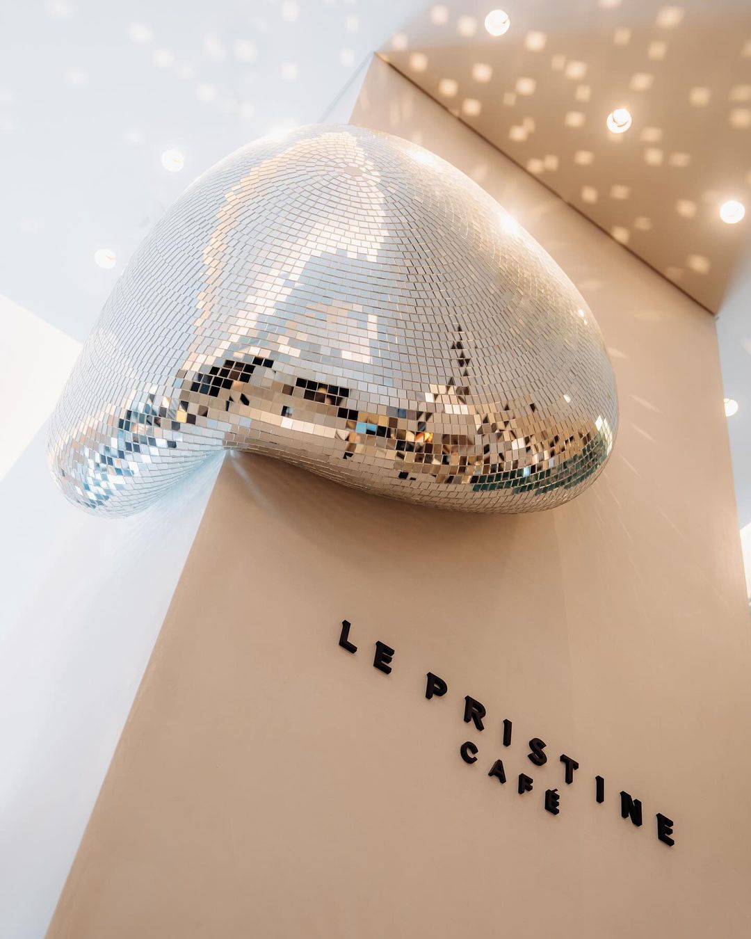 silver disco ball installation by ROTGANZEN - top 2024 design trends