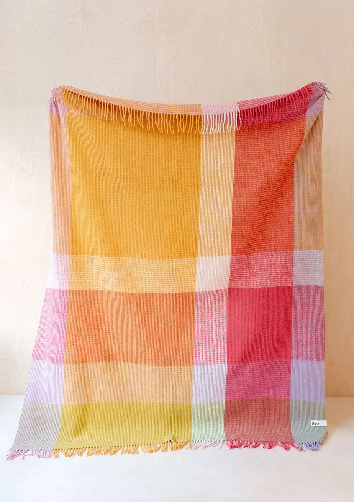 Orange check recycled wool blanket from wallflower shop!