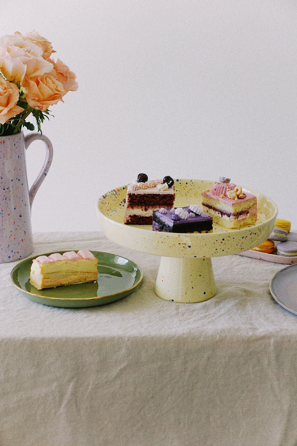 easter desserts and pastel cakes on yellow cake stand ~ wallflower shop