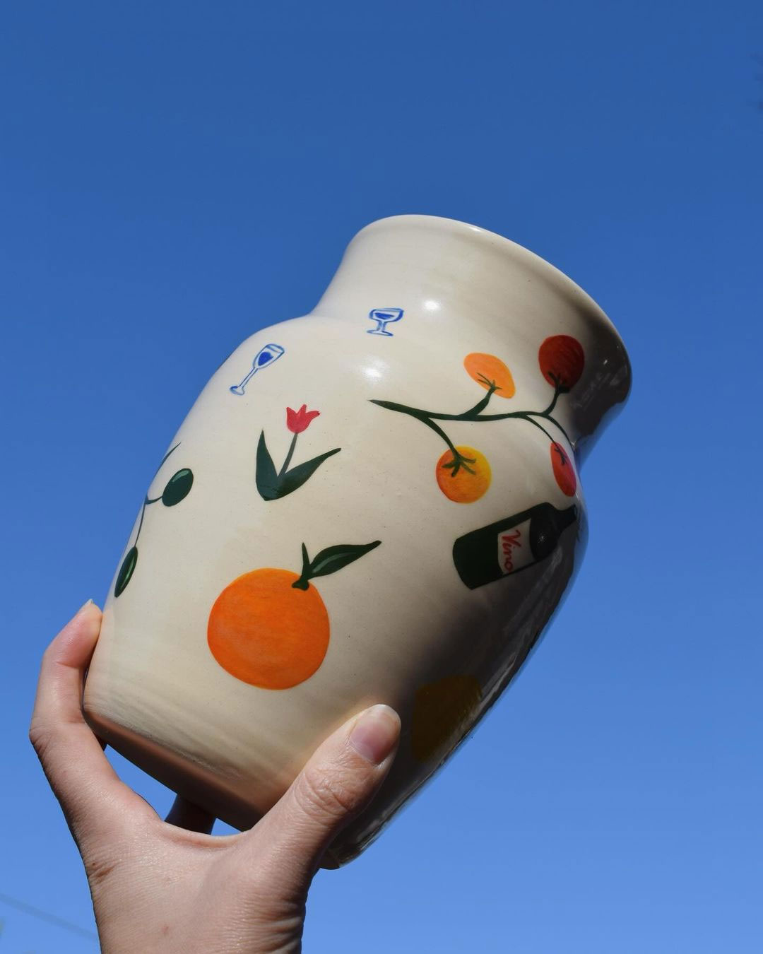 Garden party fruit and tulip painted vase by https://www.nikkiestuttsceramics.com/