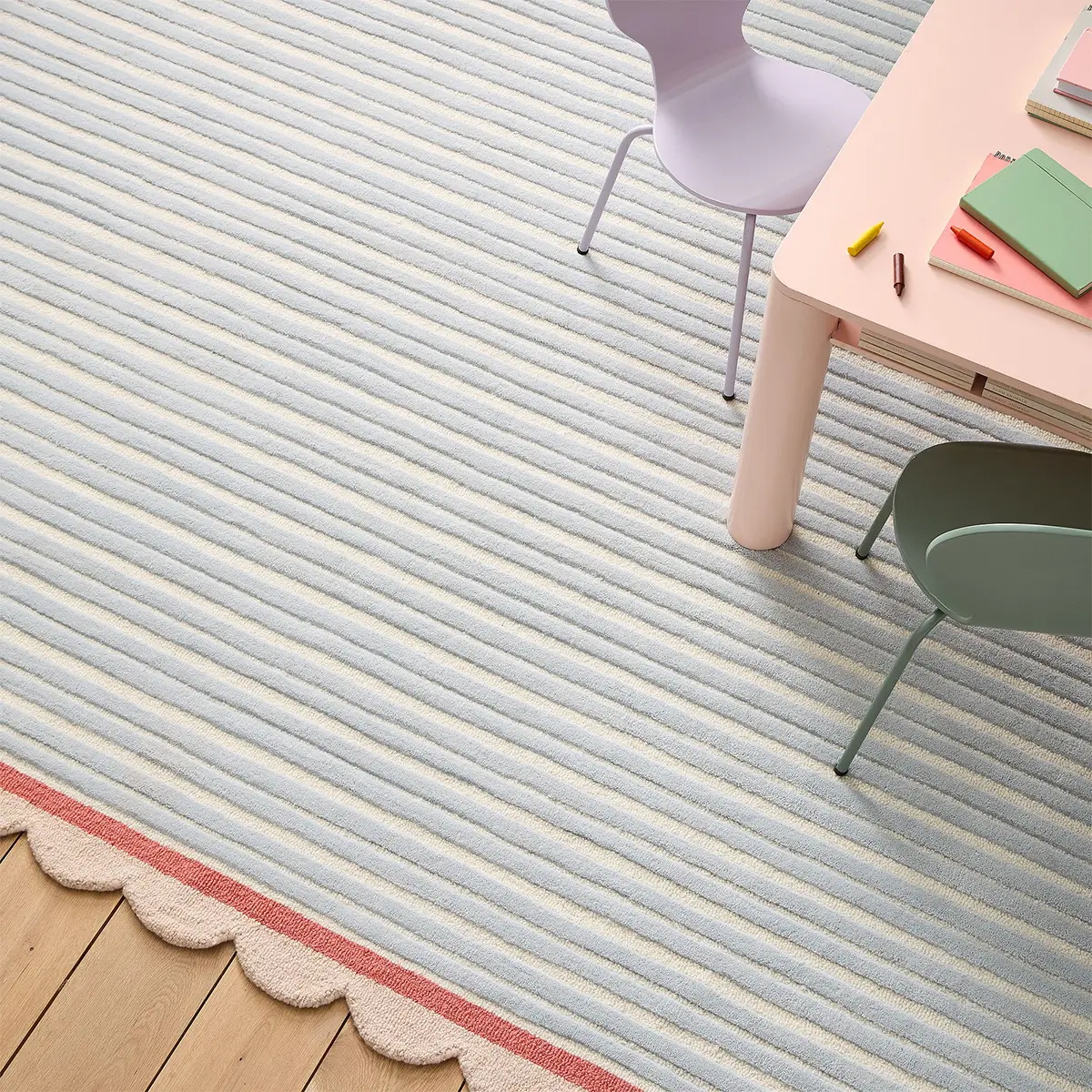 striped and scalloped nursery rug